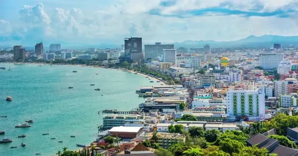 Traveler checking phone at Thailand airport immigration